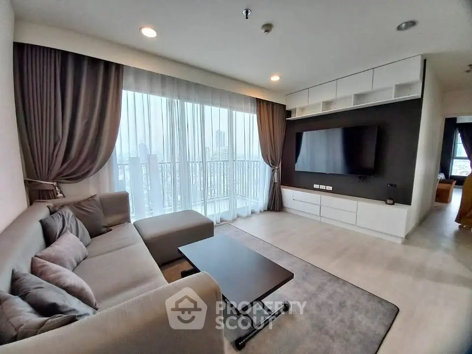 Modern living room with large windows and city view