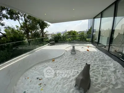 Spacious balcony with unique sand play area and city view