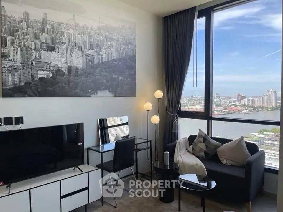 Modern living room with stunning city view, stylish decor, and large windows for natural light.