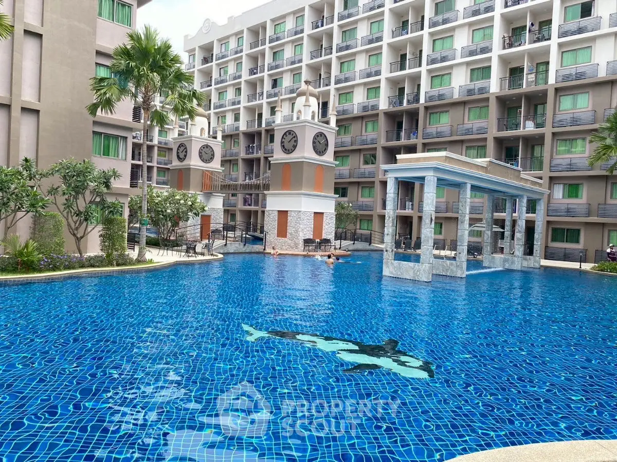Luxurious apartment complex with stunning pool and modern architecture.