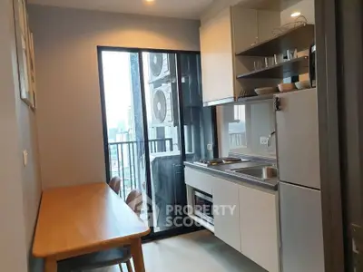 Modern kitchen with open layout and city view from balcony