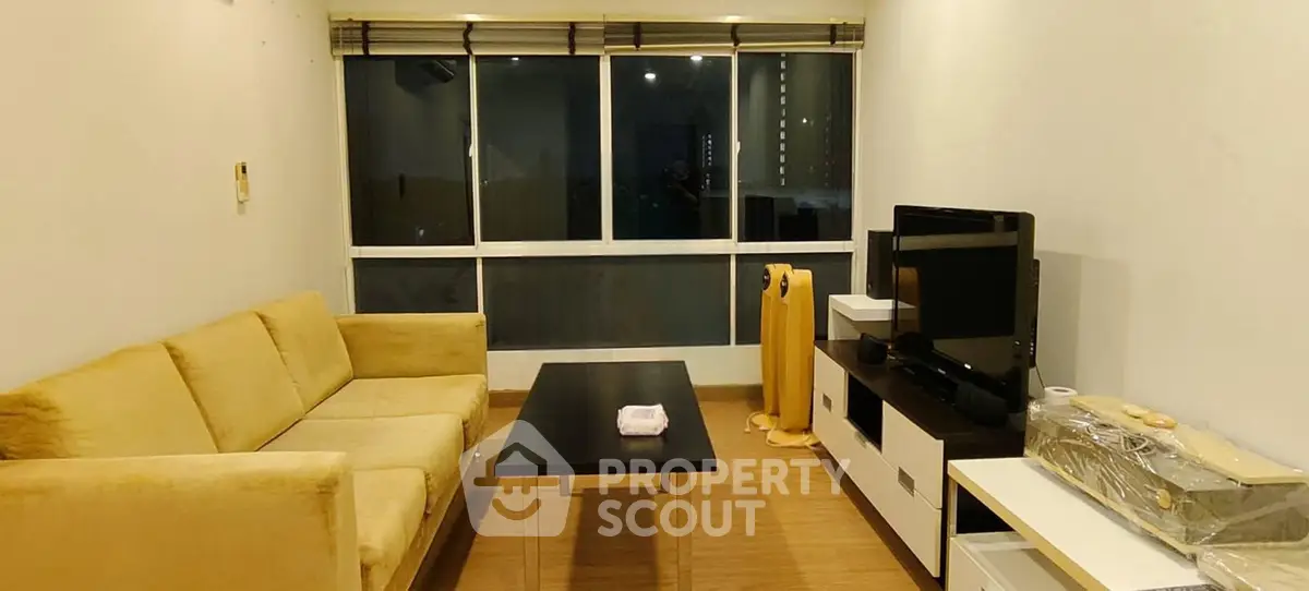 Cozy living room with modern furniture and large window view