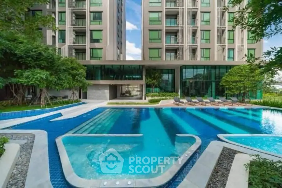 Luxurious apartment complex with stunning pool and modern architecture