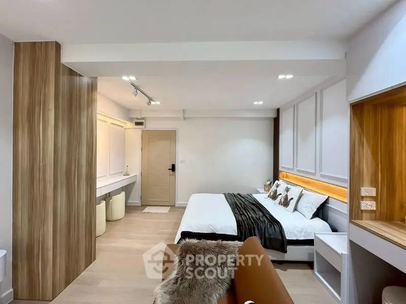 Modern bedroom with stylish wood accents and cozy lighting