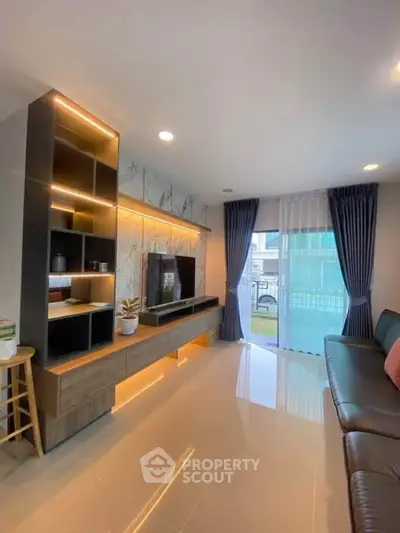 Modern living room with sleek design and large window for natural light