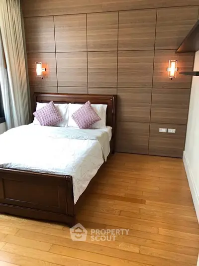 Elegant bedroom with wooden paneling and cozy lighting