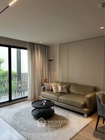 Modern living room with cozy sofa and balcony view