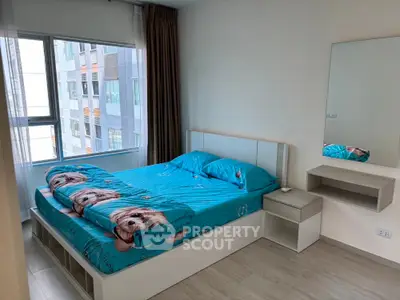 Modern bedroom with large window and stylish decor in urban apartment