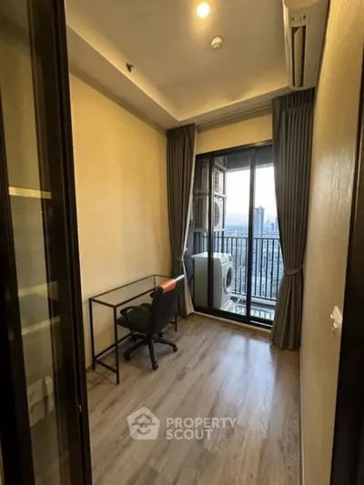 Modern study room with balcony view in high-rise apartment