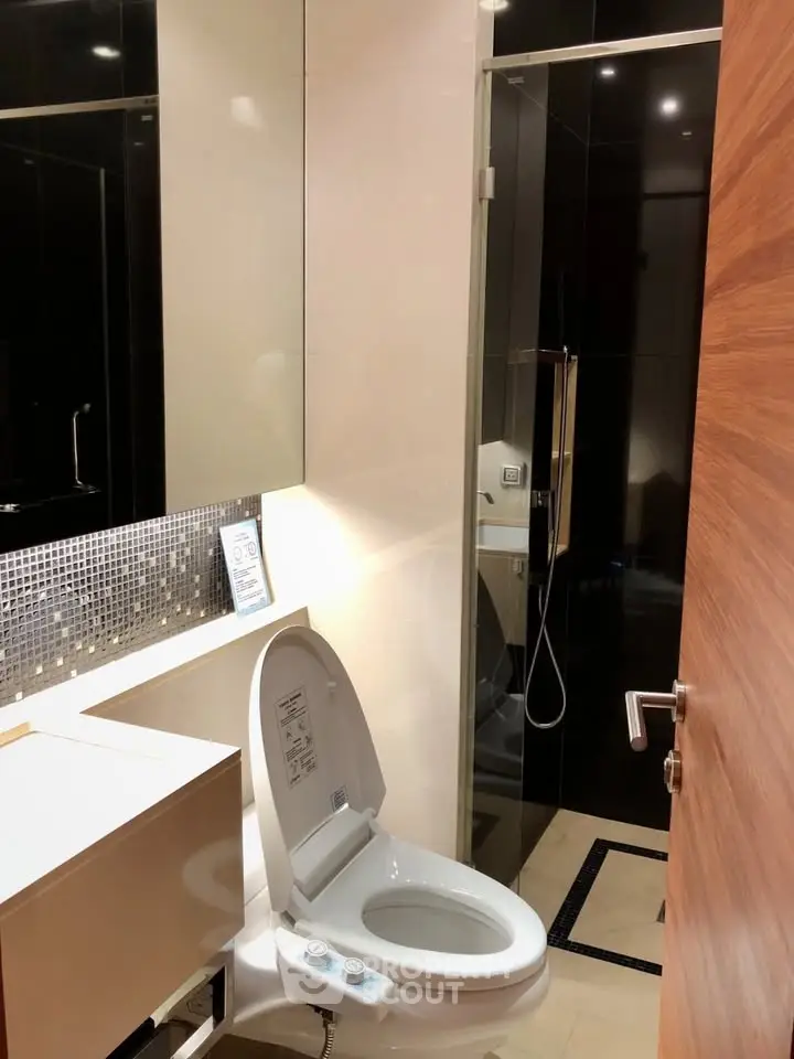 Modern bathroom with sleek design and high-end fixtures in a luxury apartment.