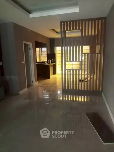 Modern apartment interior with sleek kitchen and stylish partition wall