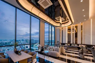 Luxurious high-rise living room with panoramic city views and modern decor