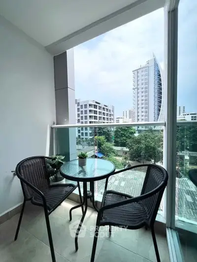 Charming balcony with city view, perfect for relaxation and enjoying urban living.