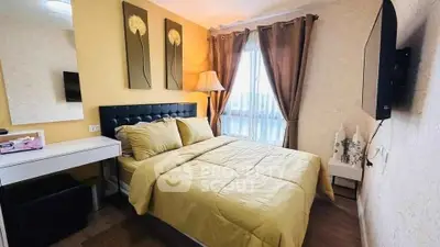 Cozy bedroom with modern decor and ample natural light