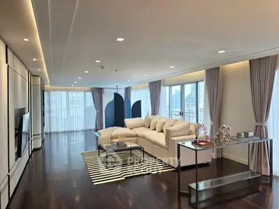 Luxurious modern living room with elegant decor and city view, featuring a spacious layout and stylish furnishings.
