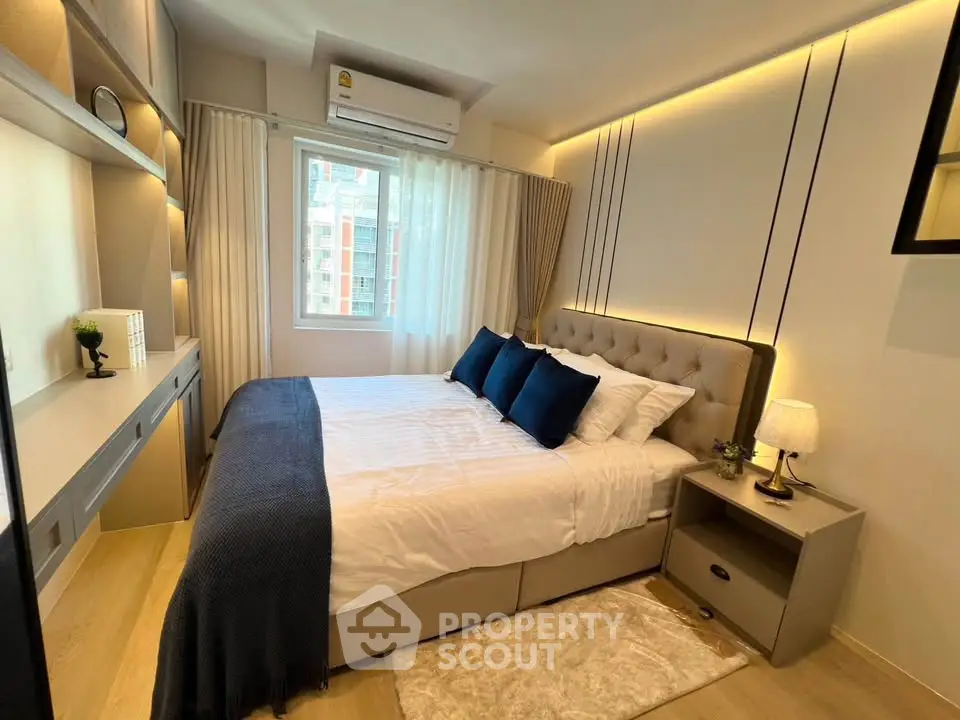 Modern bedroom with stylish decor and natural light