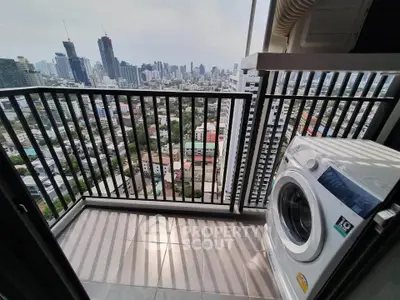 High-rise balcony with stunning city view and washing machine, perfect for urban living.