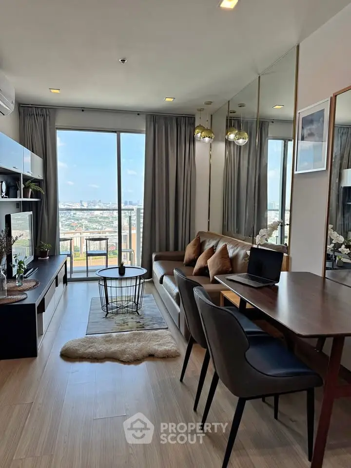 Modern living room with city view, stylish furniture, and elegant decor in a high-rise apartment.