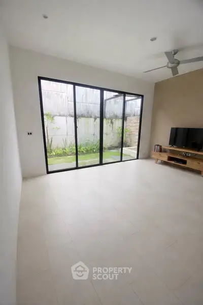 Spacious living room with garden view and modern decor