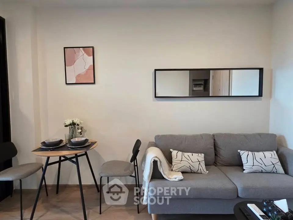 Modern living room with stylish decor and cozy seating area, perfect for relaxation and entertaining.