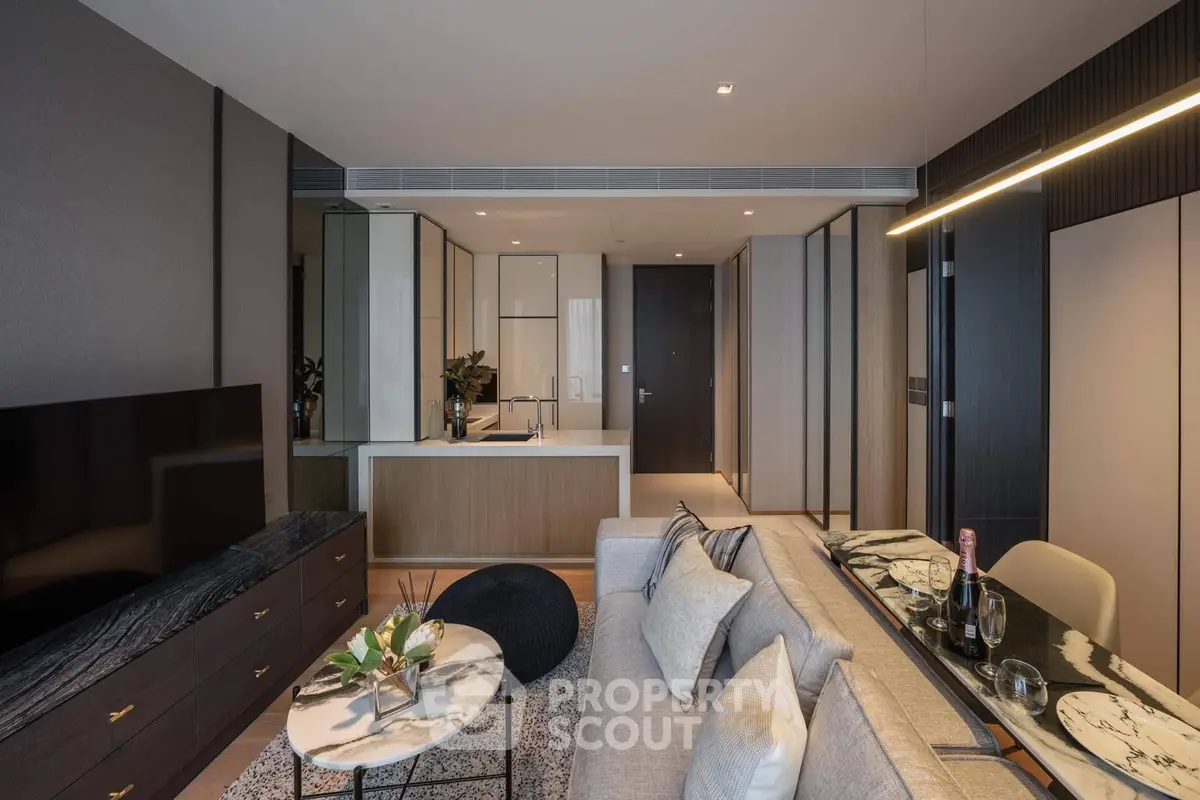 Modern living room with sleek design and open kitchen layout