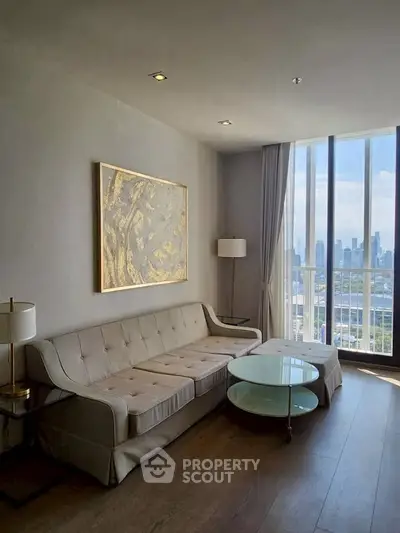 Elegant living room with city view, modern sofa, and stylish decor.