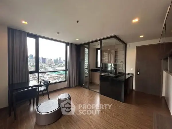Modern living room with city view and sleek kitchen design