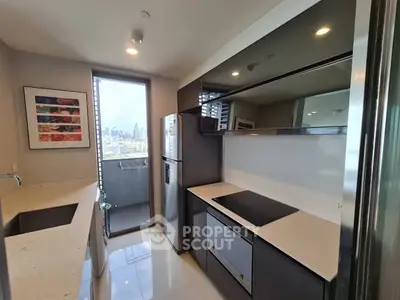 Modern kitchen with sleek design and city view from balcony