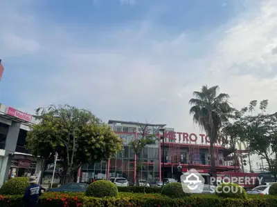 Commercial building with vibrant signage and lush landscaping