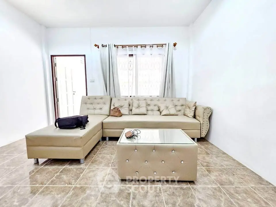 Spacious living room with elegant beige sofa and modern decor