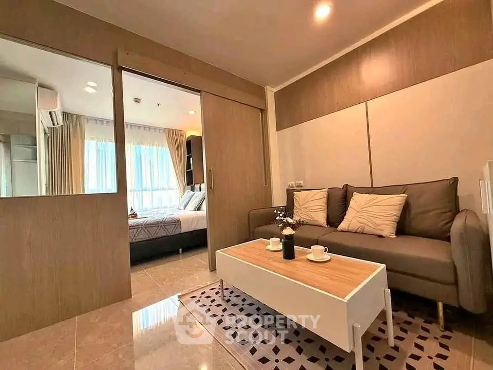 Modern living room with cozy sofa and stylish decor in open layout apartment