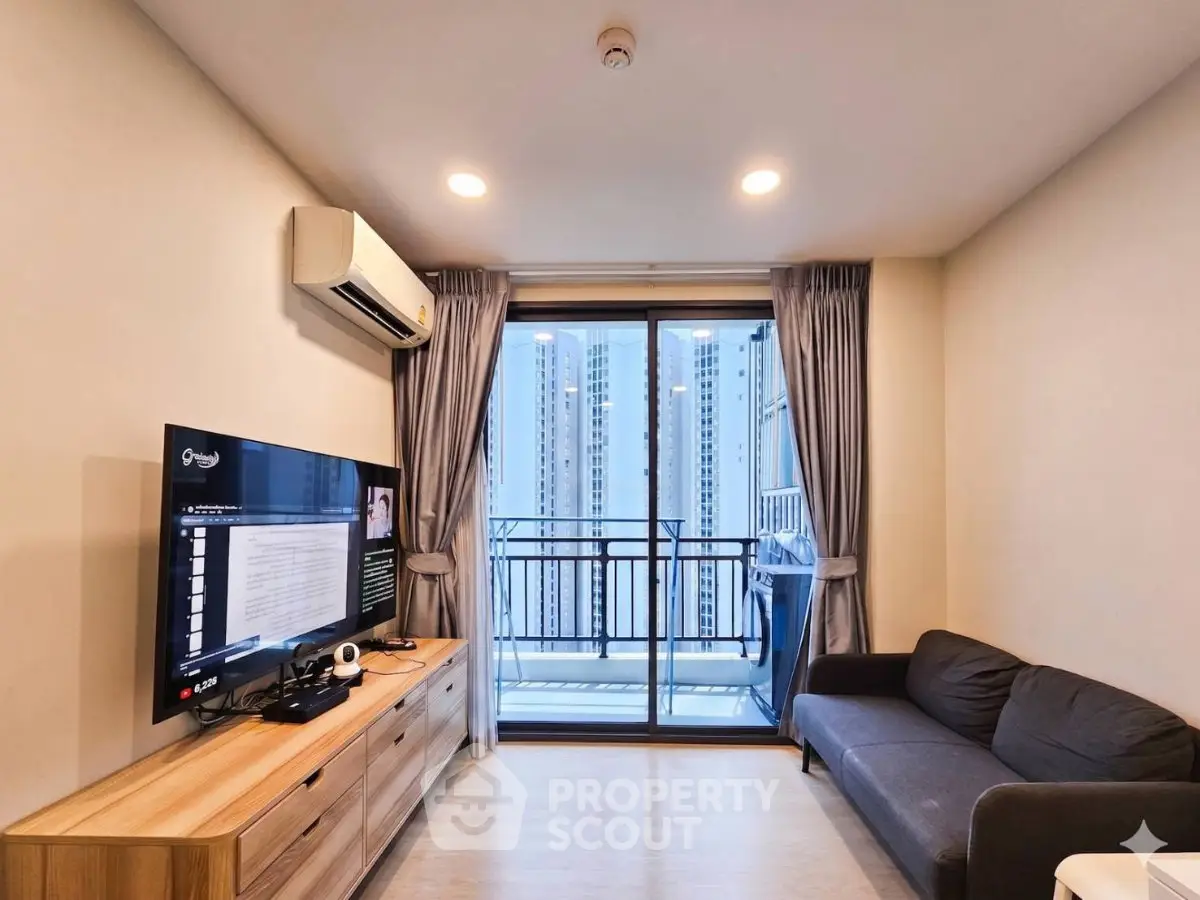 Modern living room with balcony view in high-rise apartment