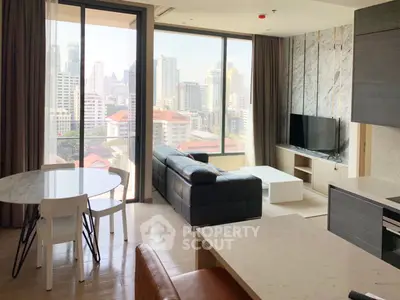 Modern living room with city view, featuring sleek furniture and large windows for natural light.