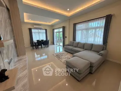 Spacious modern living room with elegant lighting and large sectional sofa