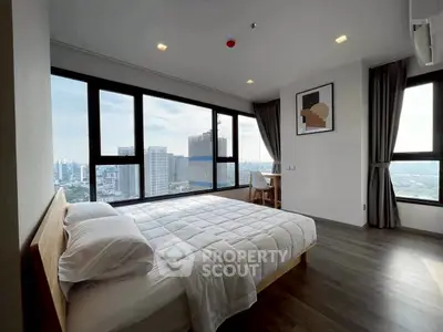 Modern bedroom with stunning city view and minimalist decor