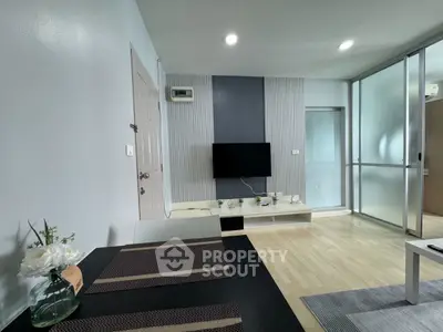 Modern living room with sleek TV setup and elegant decor
