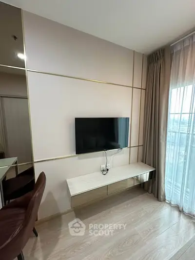 Modern living room with wall-mounted TV and elegant decor