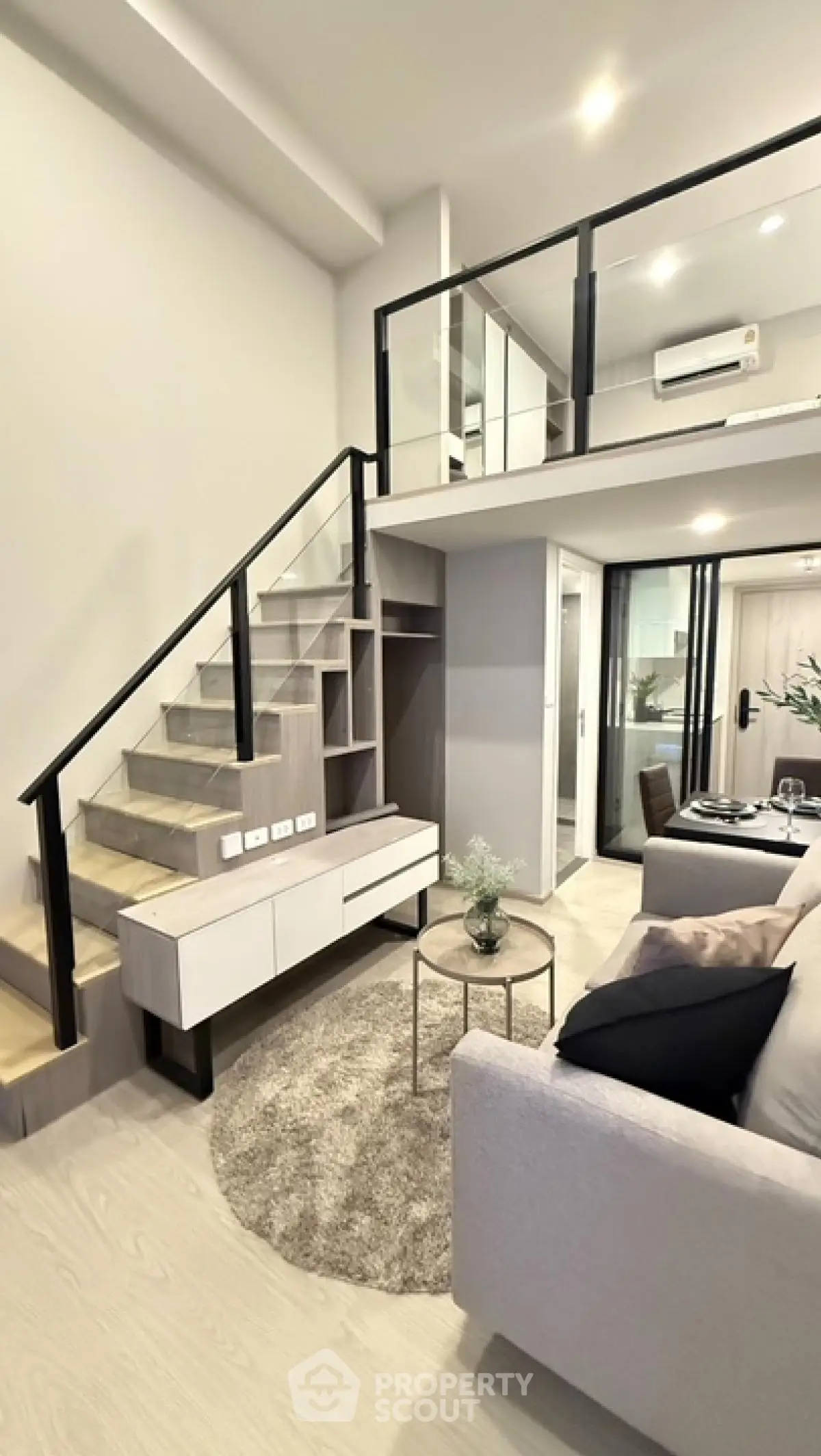 Modern loft apartment with stylish mezzanine and cozy living area