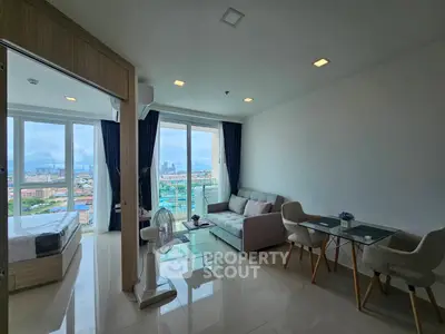 Modern open-plan living room with city view and stylish furniture