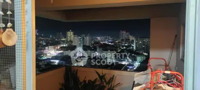 Stunning cityscape view from a spacious balcony at night, perfect for urban living enthusiasts.