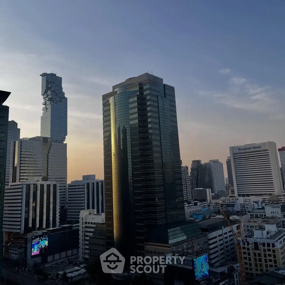 Stunning cityscape view featuring modern high-rise buildings at sunset.