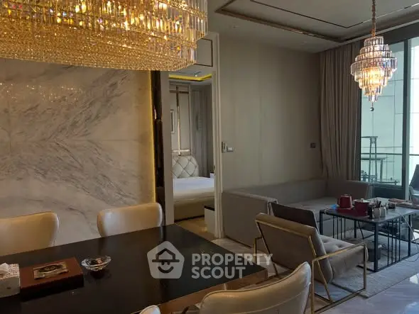 Luxurious living room with elegant chandeliers and marble accents