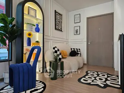 Stylish modern living room with unique furniture and decor, featuring a cozy seating area and vibrant accents.