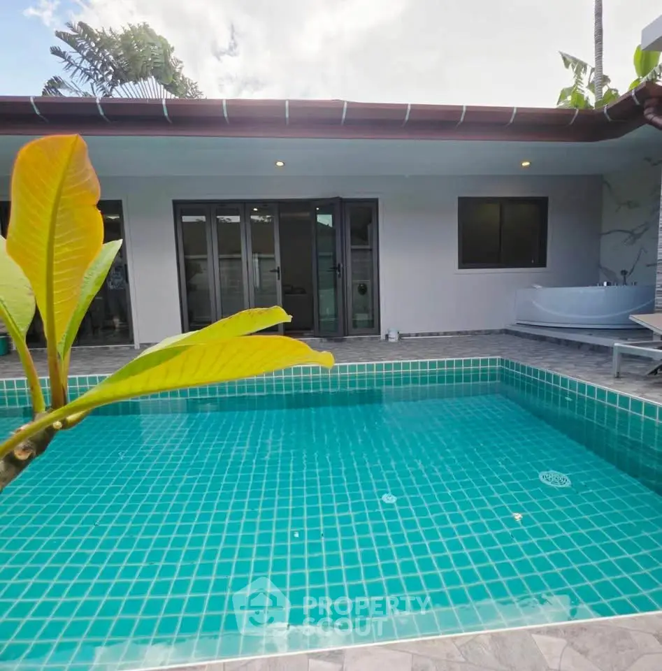 Luxurious villa with private turquoise pool and modern exterior design, perfect for relaxation and entertainment.