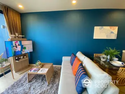 Stylish living room with blue accent wall and modern decor