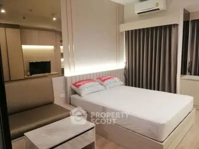 Modern bedroom with stylish decor and ambient lighting, featuring a cozy bed and elegant furnishings.