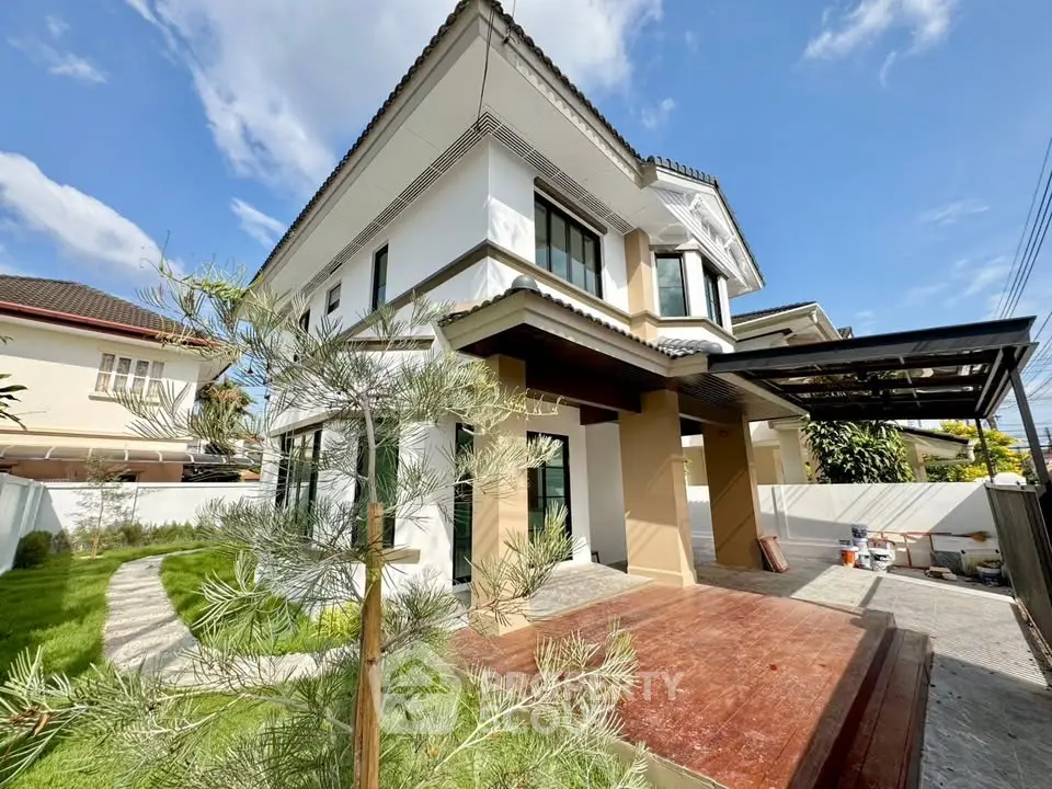 Stunning two-story house with modern architecture and spacious driveway in a serene neighborhood.