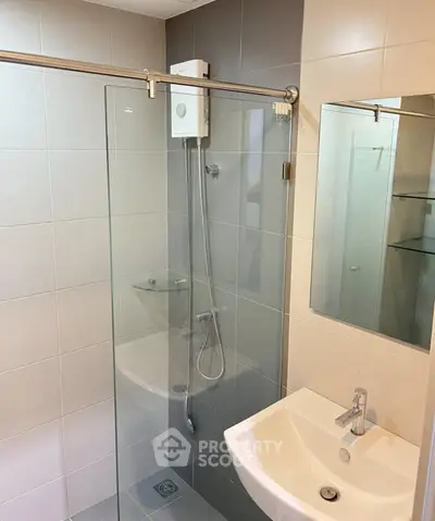 Modern bathroom with glass shower and sleek fixtures