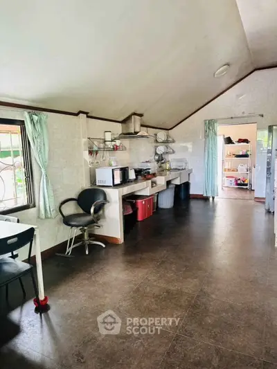 Spacious kitchen with open layout and modern appliances, perfect for culinary enthusiasts.