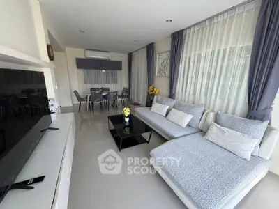 Spacious modern living room with elegant decor and ample natural light